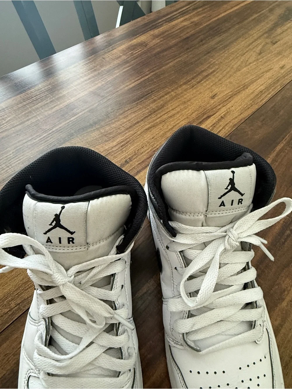 Nike Air Jordan 1 White and Black Mid-Top Sneakers